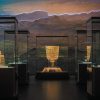 Gold artifacts displayed in climate-controlled museum display cases