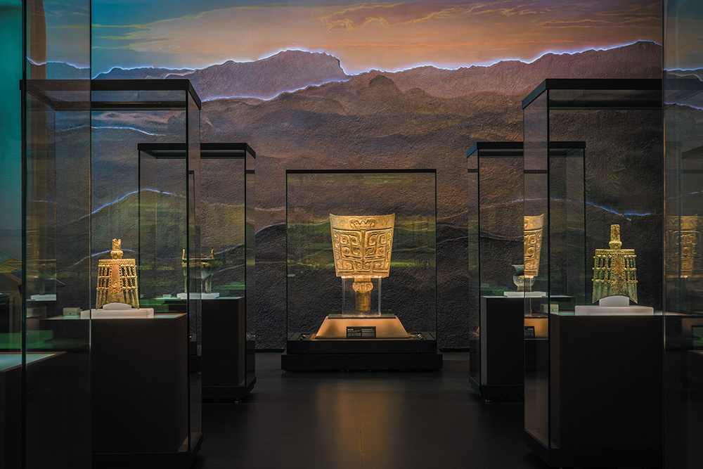 Gold artifacts displayed in climate-controlled museum display cases
